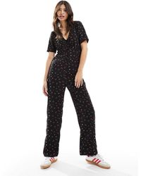 Jdy - Mono Largo De Pernera Ancha Con Estampado Floral De - Lyst