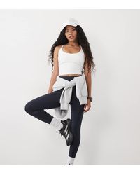 4505 - Petite Icon Active Tie Waist Run legging With Phone Pocket - Lyst