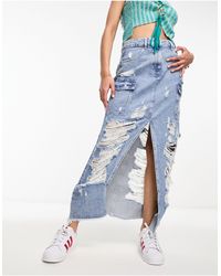 Miss Selfridge - Gonna cargo di jeans con strappi vistosi lavaggio chiaro - Lyst