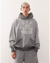 Champion - Sweat à capuche à imprimé graphique - délavé - Lyst