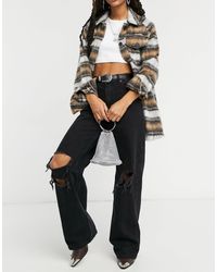 Bershka Jeans neri anni '90 con fondo ampio e tagli sulle ginocchia - Nero