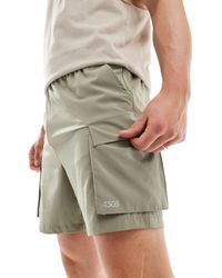 ASOS 4505 - Pantalones cortos s deportivos con bolsillos cargo - Lyst
