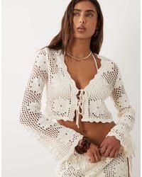 The Frolic - Exclusive Crochet Tie Front Long Sleeve Beach Crop Top - Lyst