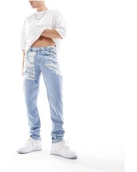 ASOS - Jeans skinny lavaggio chiaro con strappi vistosi - Lyst