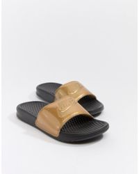 nike slippers black and gold