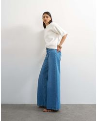 TOPSHOP - Horizon Mid Rise Wide Leg Jean - Lyst