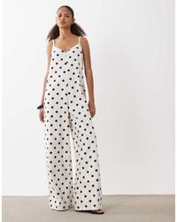 ASOS - Zachte Denim Jumpsuit Met Wijde Pijpen En Stippenprint - Lyst