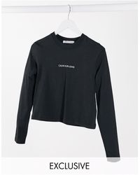 Calvin Klein T-shirt corta a maniche lunghe nera con logo sul retro - Nero