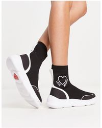 Love Moschino - Zapatillas tipo calcetín negras y blancas con logo - Lyst