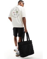 ASOS - T-shirt oversize avec imprimé tennis et club au dos - blanc cassé - Lyst
