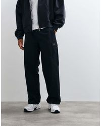 New Balance - Woven Cargo Pant - Lyst