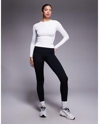 4505 - Seamless Rib Quick Dry Long Sleeve Henley Layering Top - Lyst