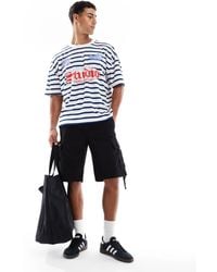 ASOS - – kastiges oversize-t-shirt mit rippstruktur-streifen, überschnittenen schultern und sport-grafikprints - Lyst