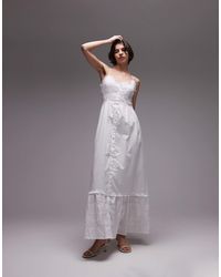 SNDY'S - Robe boutonnée longue à bretelles fines avec bordures volantées en broderie anglaise - Lyst