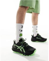 Asics - Gel-trabuco 12 gtx - sneakers da trail running resistenti all'acqua nere e verde fluo - Lyst