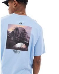 The North Face - Camiseta azul acero con estampado gráfico retro en la espalda camping exclusiva en asos - Lyst
