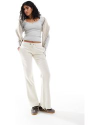 Superdry - Athletic Essentials Low Rise Flare Joggers - Lyst