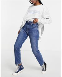 Stradivarius - – schmal geschnittene mom-jeans mit stretchanteil - Lyst