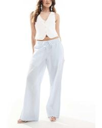Hollister - Gestreepte Baggy Broek Met Lage Taille En Elastische Taille - Lyst