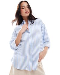Stradivarius - Chemise à manches longues en aspect lin rayé - clair - Lyst