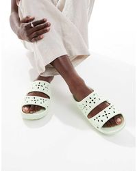 Crocs™ - Sandalias Jade Pálido Clásicas Con Aberturas En Formas De Flores De - Lyst