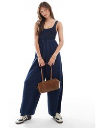 ASOS - Soft Denim Wide Leg Jumpsuit With Shirred Body - Lyst