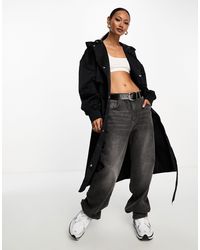 Nike - Trench-coat avec petit logo virgule - Lyst