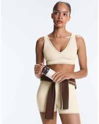 Oysho - Medium-Support Comfortlux Sports Bra With Hemstitch - Lyst