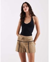 laagam - Kali Mid Rise Double Waistband And Tie Skort - Lyst