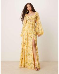 ASOS - Vestido Largo Amarillo De Manga Larga Con Abertura, Falda Fruncida Y Estampado Floral De - Lyst