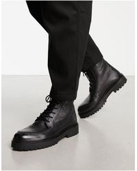 Schuh - Botas negras con cordones y suela gruesa - Lyst