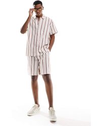 ASOS - Short d'ensemble ajusté à rayures contrastantes - rouge - Lyst
