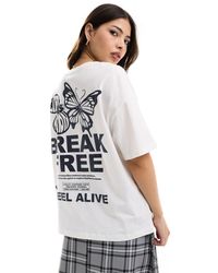 Bershka - T-shirt oversize à imprimé papillon - écru - Lyst