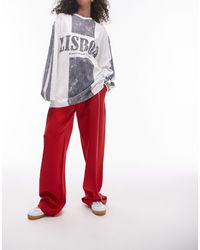 TOPSHOP - Pantaloni sportivi rossi con fondo ampio - Lyst