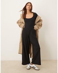 ASOS - Tuta Jumpsuit Nera A Coste Con Maniche Lunghe E Scollo Rotondo - Lyst