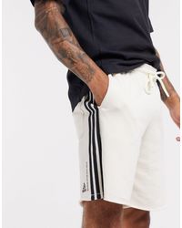 pantaloncini adidas neri strisce bianche