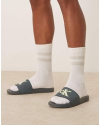 Calvin Klein - Sandalias Verde Cerceta Lima Y Blancas Con Logo Grande De - Lyst