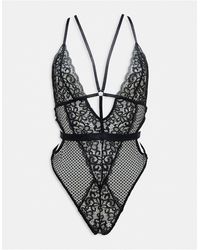 Ann Summers - Obsession Lace And Fishnet Plunge Front Ouvert Bodysuit With Strapping Detail - Lyst