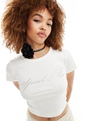 Reclaimed (vintage) - T-shirt corta e stretta bianca con grafica - Lyst