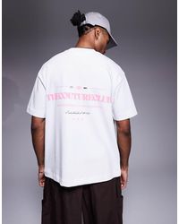The Couture Club - T-Shirt Oversize Bianca Con Stampa Rosa Del Logo Sul Petto E Sul Retro - Lyst