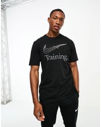 Nike - – dri-fit – es t-shirt mit swoosh-grafik - Lyst