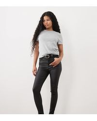ASOS - Vaqueros Negros Revestidos De Corte Pitillo Ultimate De Asos Design Petite - Lyst