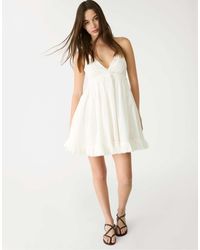 Stradivarius - – kurzes, locker sitzendes neckholder-kleid - Lyst