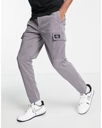 Pantalones, pantalones de vestir y chinos Calvin Klein de hombre: hasta el  57 % de descuento | Lyst