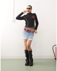 Monki - Mini-jupe en jean à taille basse - clair délavé - Lyst