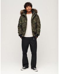 Superdry - – everest – puffer-bomberjacke mit military-muster - Lyst