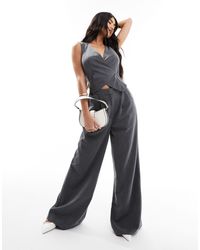 ASOS - Tuta jumpsuit grigia stile gilet a portafoglio con cintura - Lyst