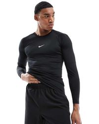 Nike - Camiseta Negra Ajustada De Manga Larga De Nike Pro Training - Lyst