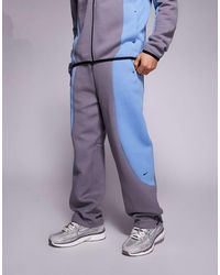 nike gingham check joggers in blue