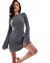 In The Style - Knitted Bell Sleeve Flippy Mini Dress With Contrast Bow Back - Lyst